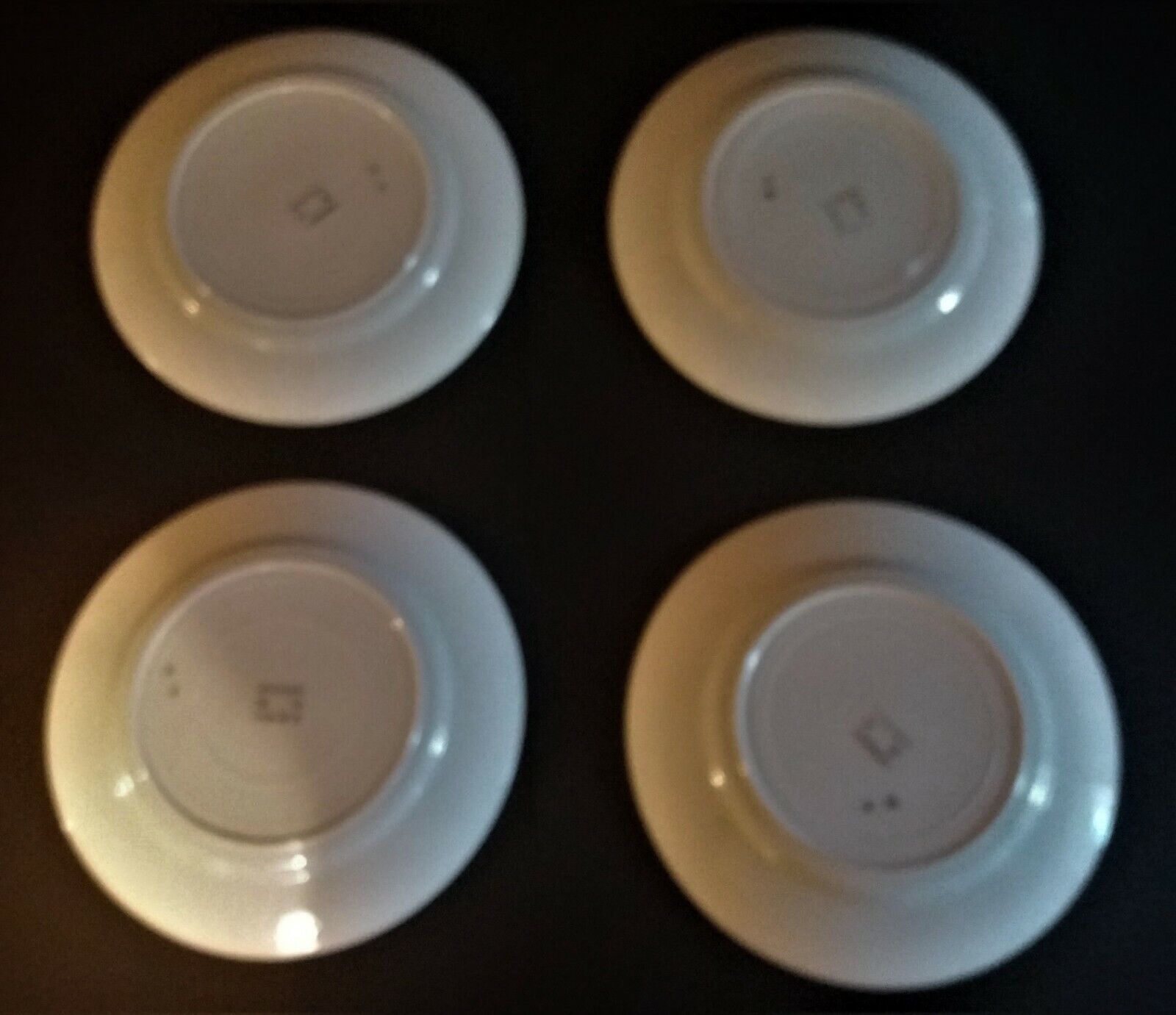 Series of four flat earthenware plates P.B. Rochechouart Limoges model Anna