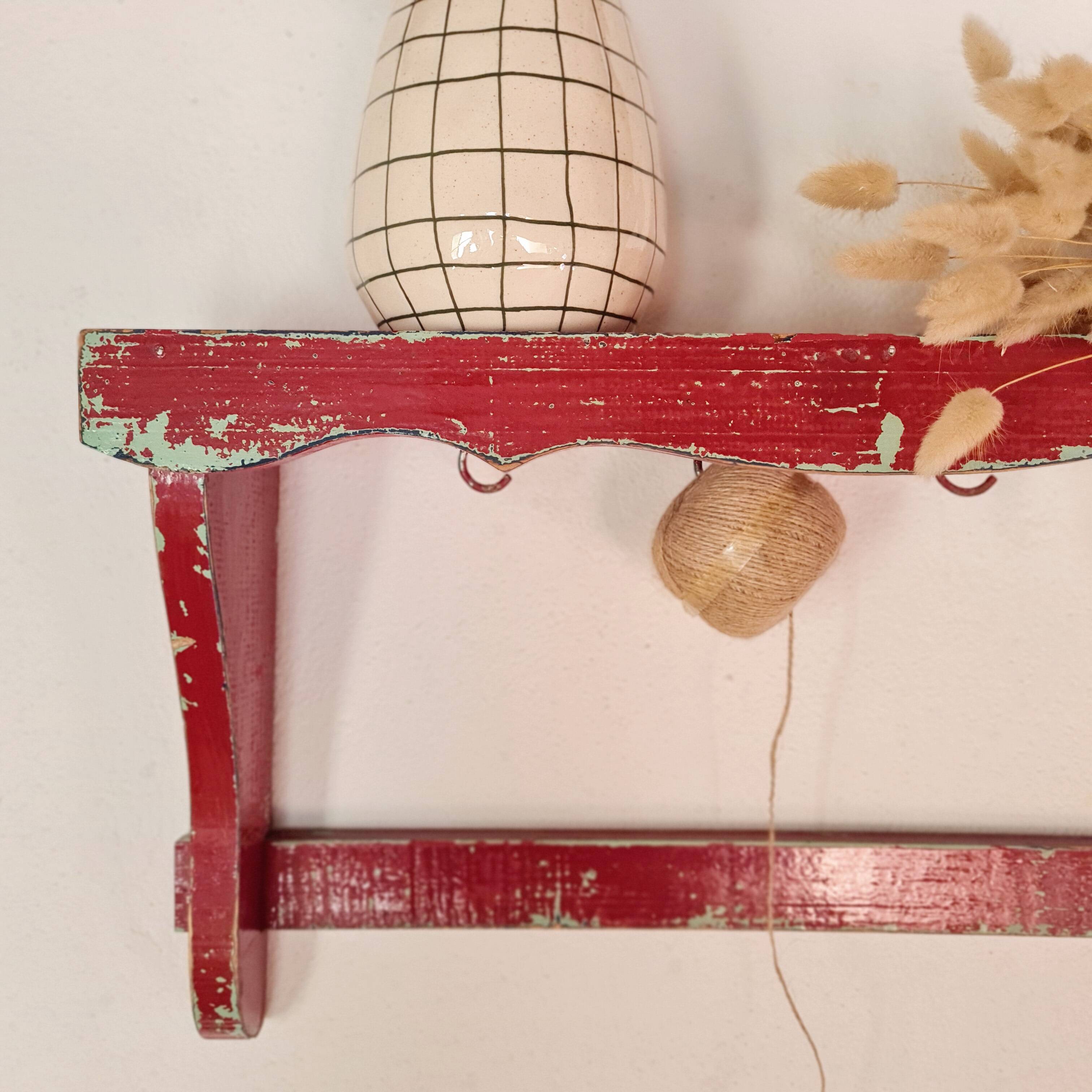 Wall shelf in garnet red wood