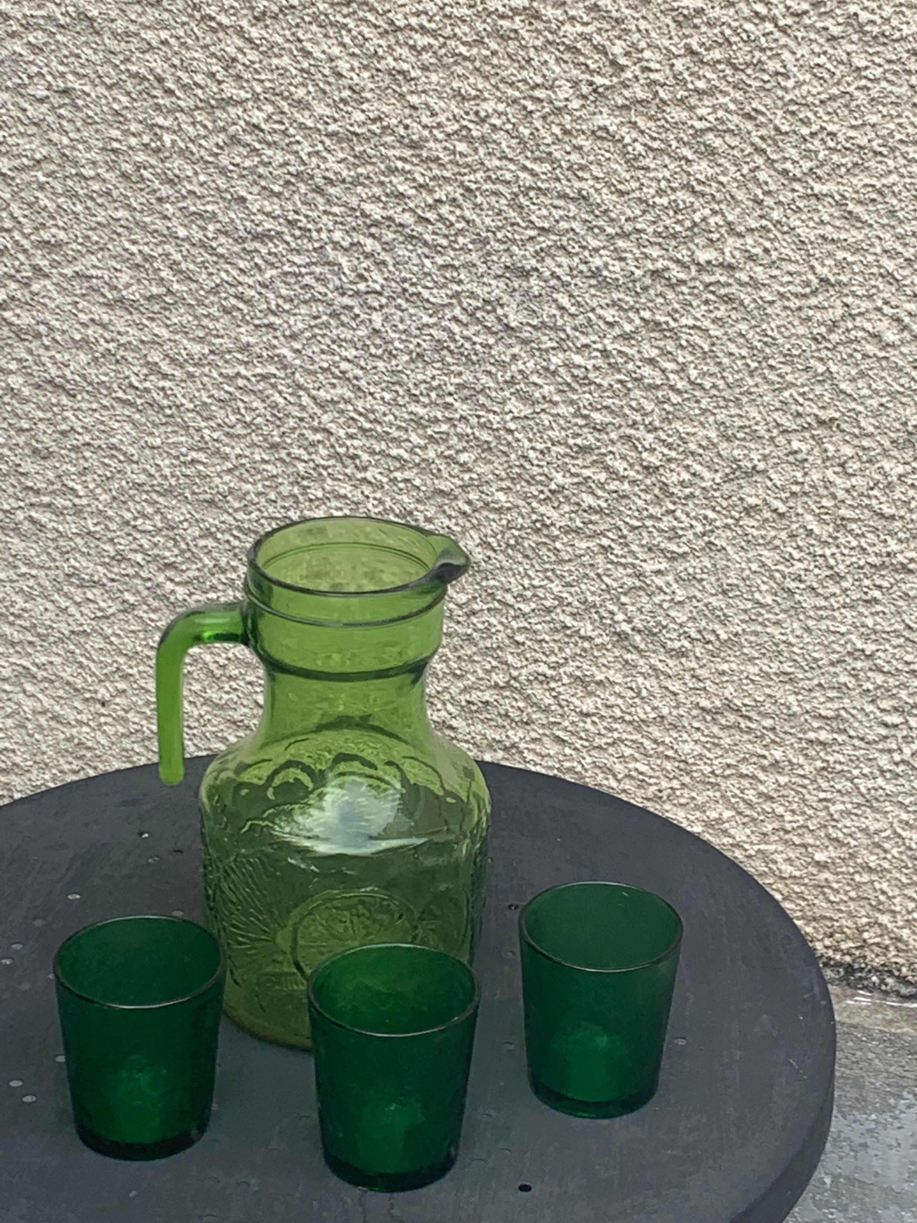 Carafe and 3 green glass glasses with vintage embossed fruit pattern