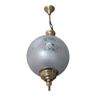 Suspension worked with fine gold a glass ball with frieze