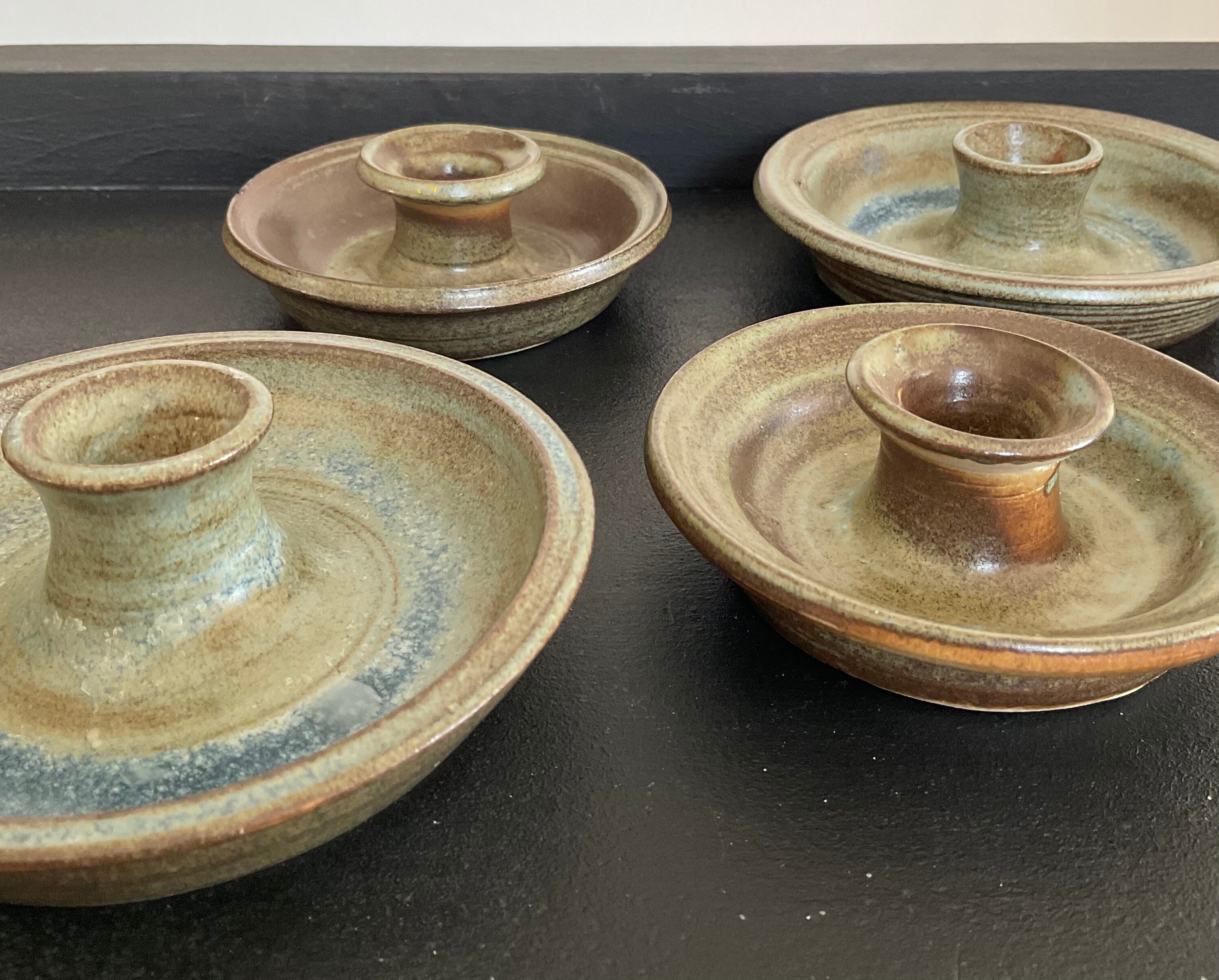 Series of 4 vintage stoneware candle holders