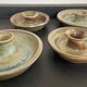 Series of 4 vintage stoneware candle holders
