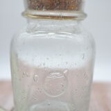 Blown glass jar with original cap