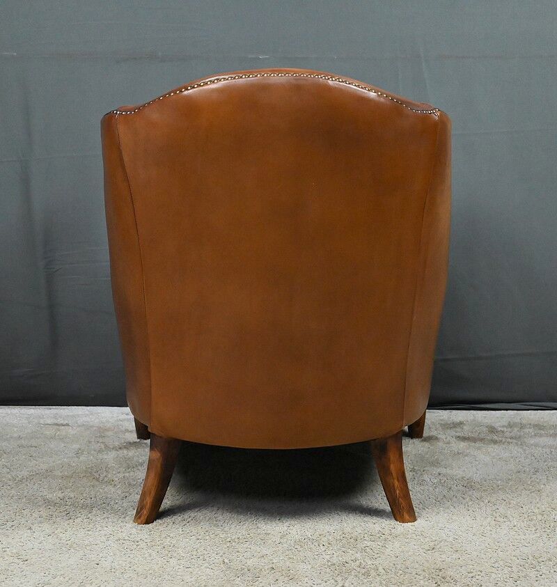 Solange club armchair in sheepskin leather.