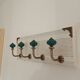 Wall-mounted coat rack in bleached wood and emerald green ceramic hooks –