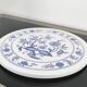 Vintage round trivet with blue floral pattern - 1970s