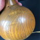 Vintage modernist lamp in wood and hammered copper.