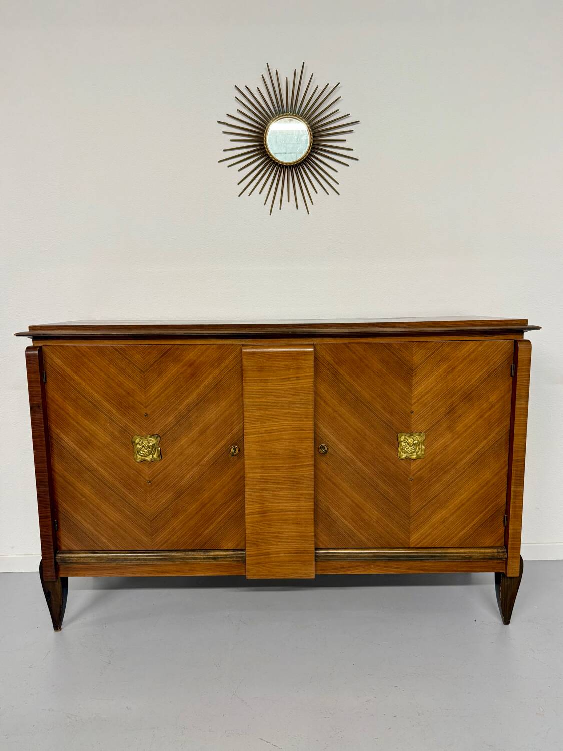 Antique art deco sideboard from the 1930s with veneered wood and bronze insert