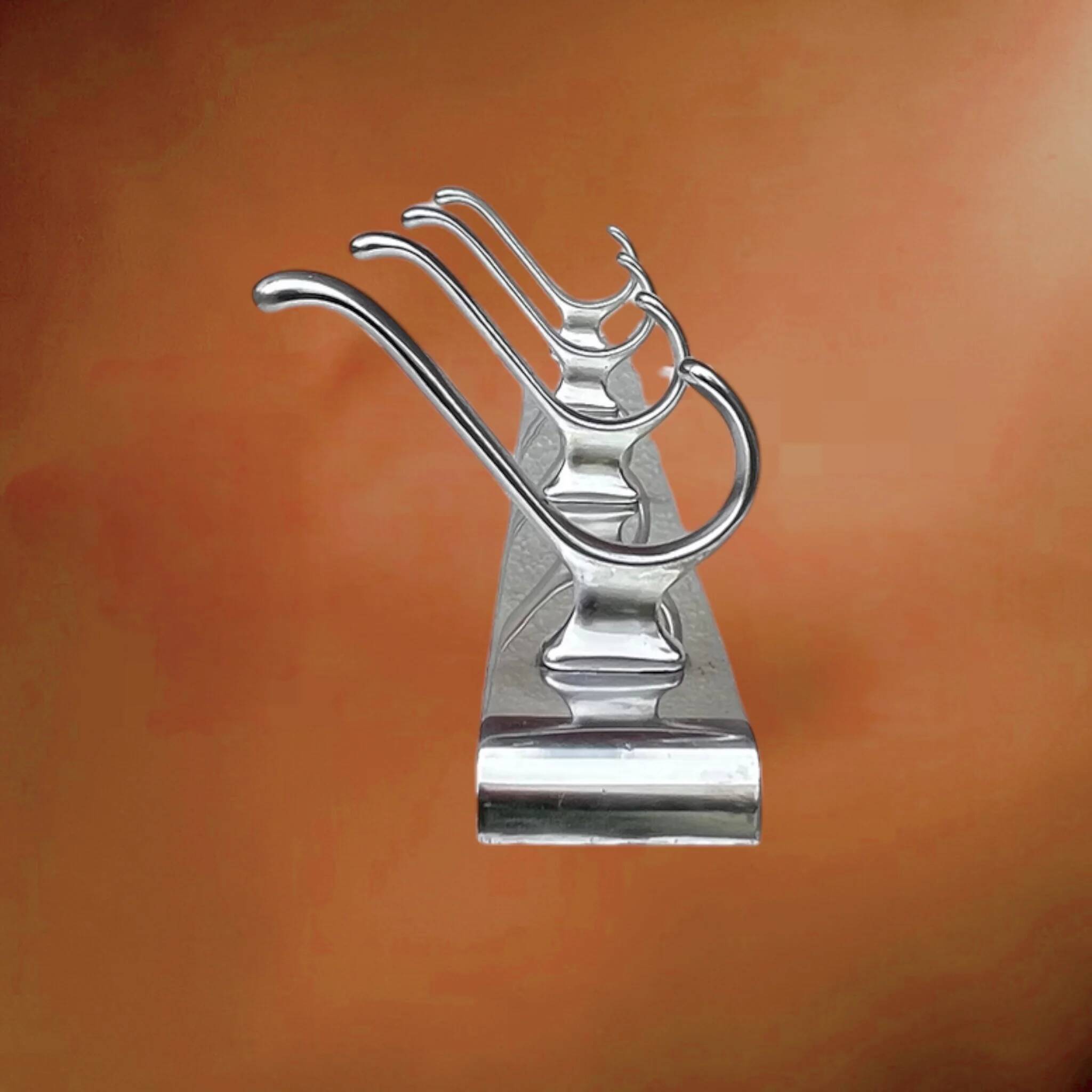 Wall-mounted coat rack in anodised aluminium with 4 hooks, modernist design - 1970s