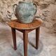 Antique round side table with oak legs and a pine top, circa 1900.