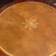 Circular table in light mahogany and leather base claw English style