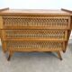 Vintage commode with tapered legs in rattan.