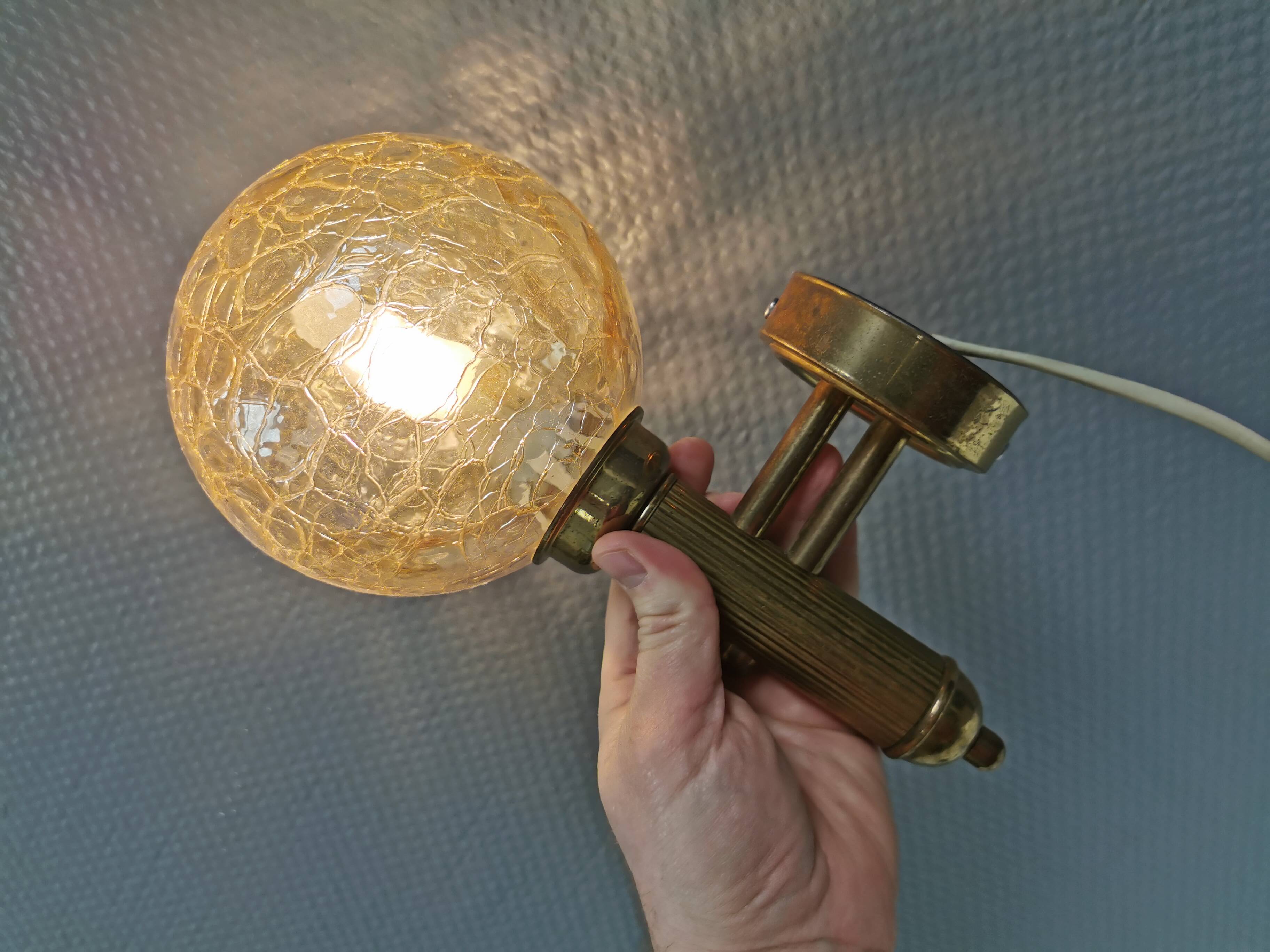 Older wall lamp in metal, brass and “cracked” glass.