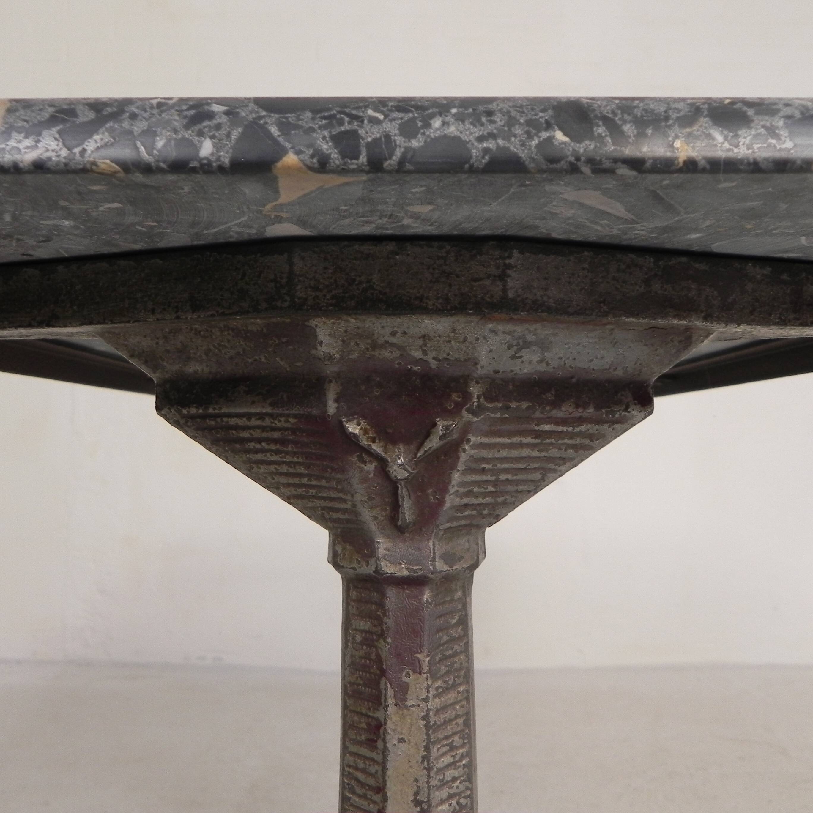Bistro table with a marble top on a cast iron frame, 1930s.