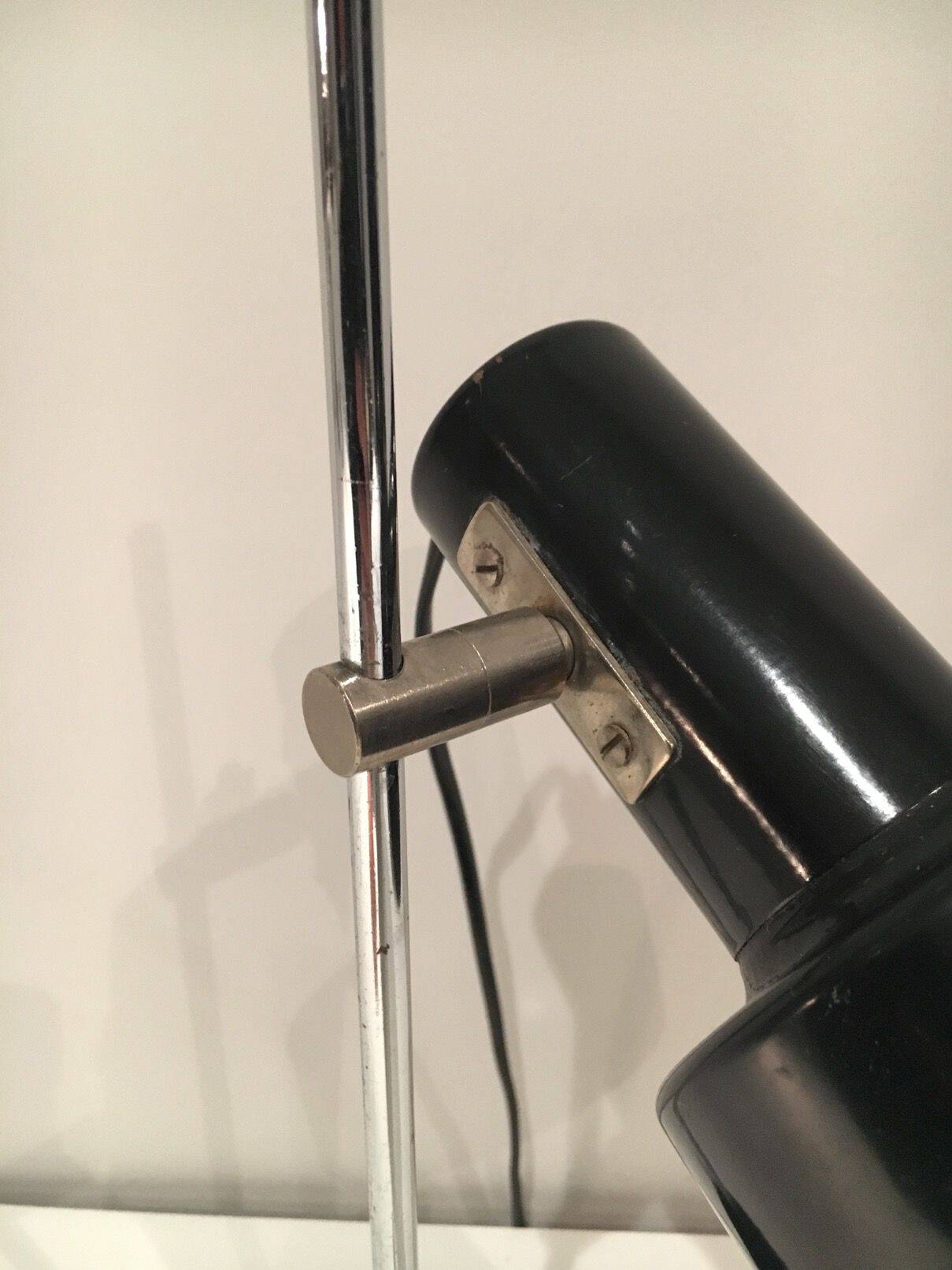 Adjustable lamp in black lacquered metal and chrome. French work. Circa 1970.