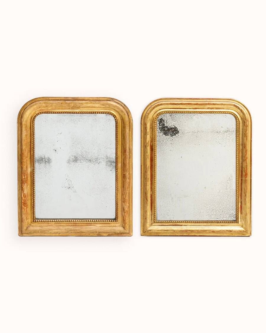 Set of two small French Louis-Philippe gilt red mirrors from the 19th century.