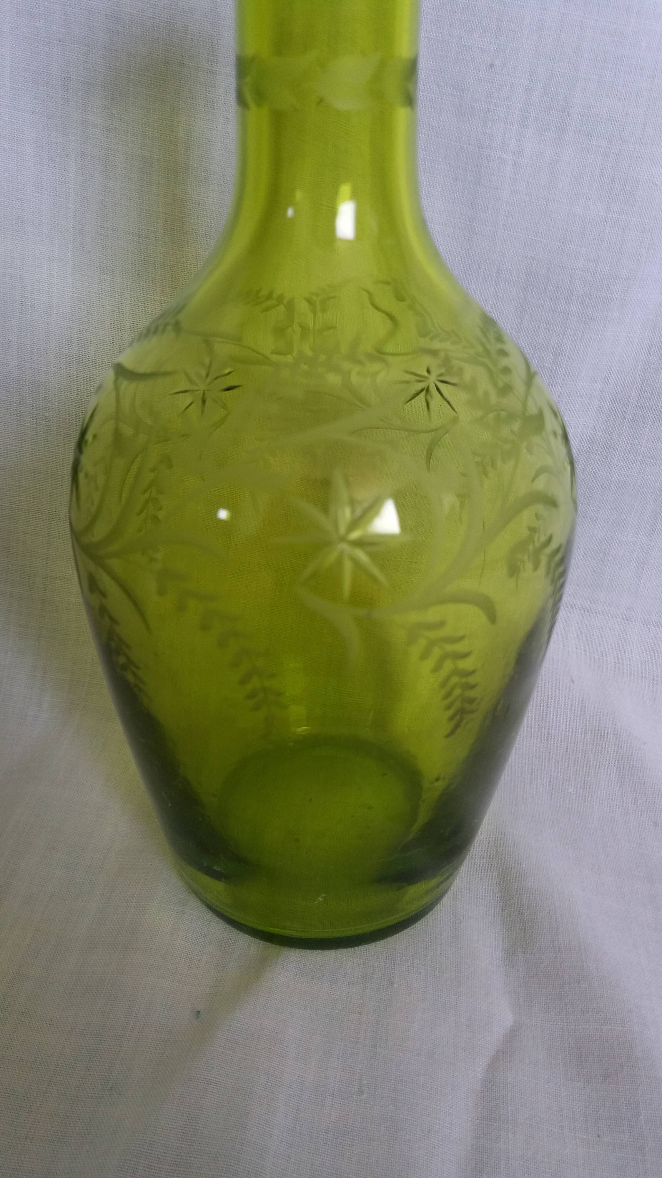 Cut and engraved green blown glass carafe vase