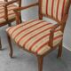 Paire de fauteuils de style parisien en bois avec des accoudoirs en tissu rayé, vintage.