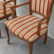 Pair of Parisian-style armchairs in wood with striped fabric armrests, vintage