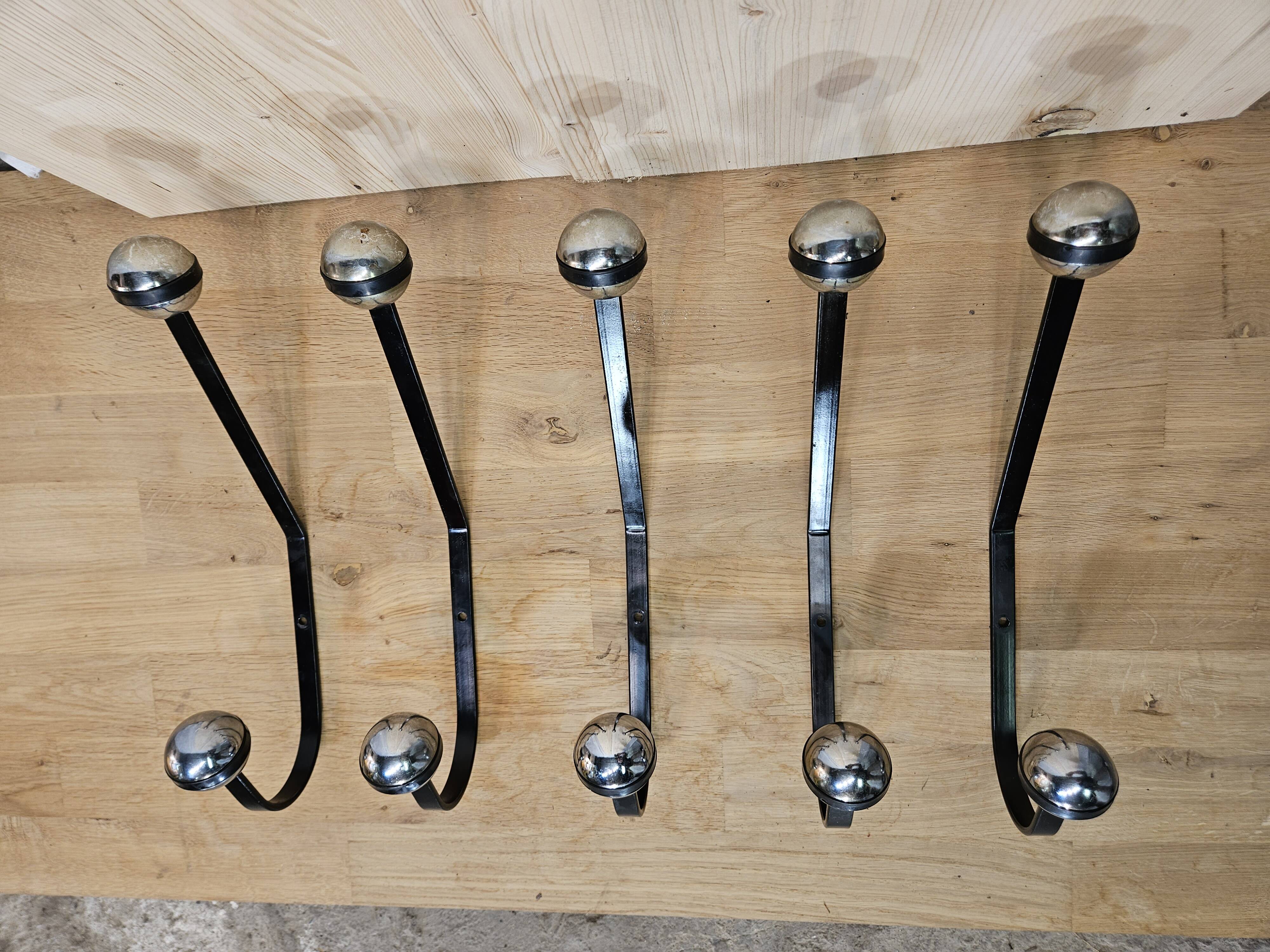 5 black and silver coat hooks from the 60s