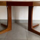 Table scandinave ronde Baumann vintage à pied central étoile extensible