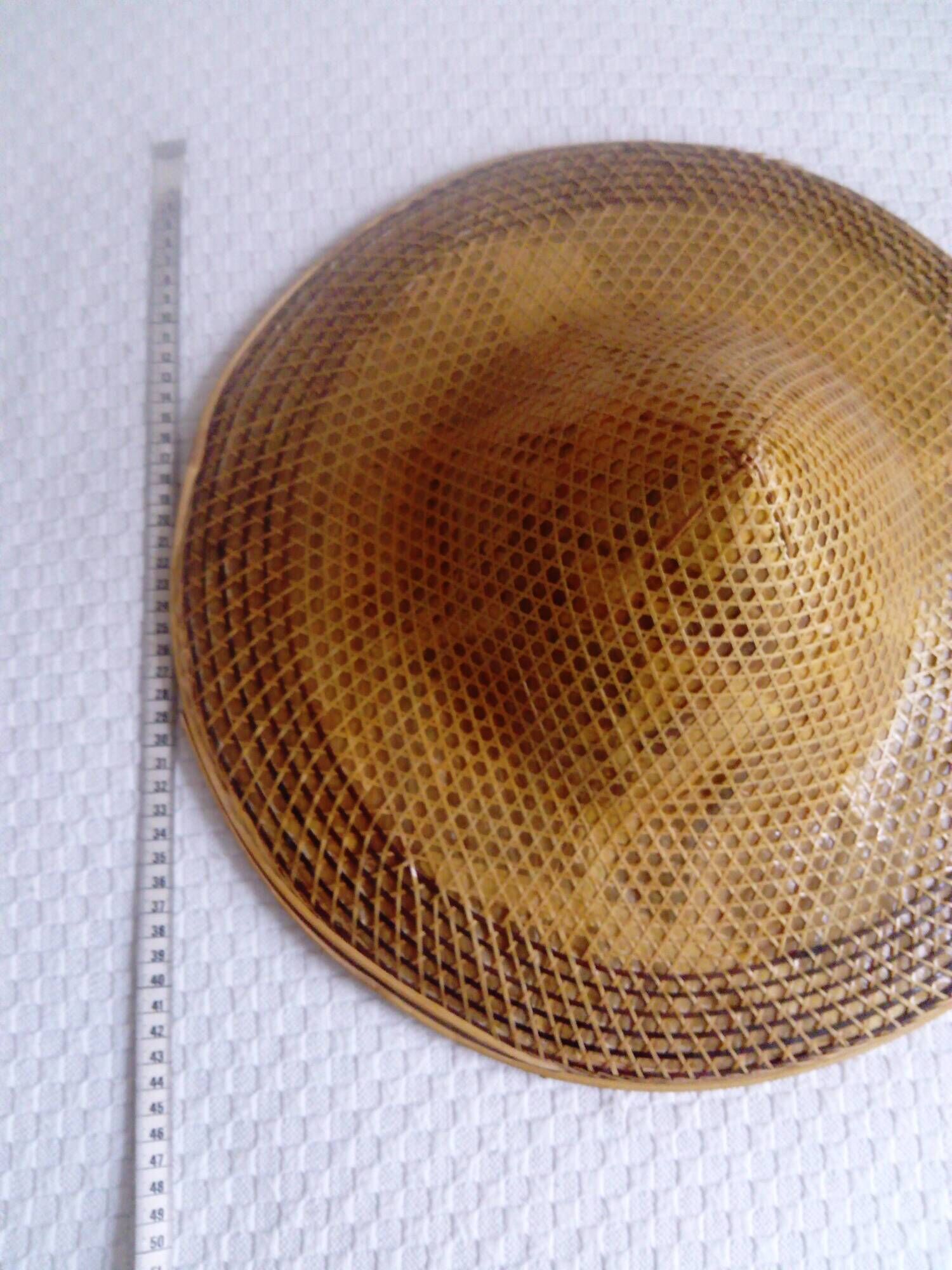 braided Asian hat. palm, bamboo, straw, wicker