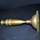 Antique baluster candlestick in bronze with hand-chiseled design.