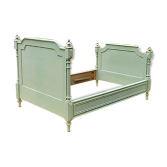 Bed frame in green painted wood