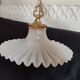 Round pendant light in pleated semi-opaque glass