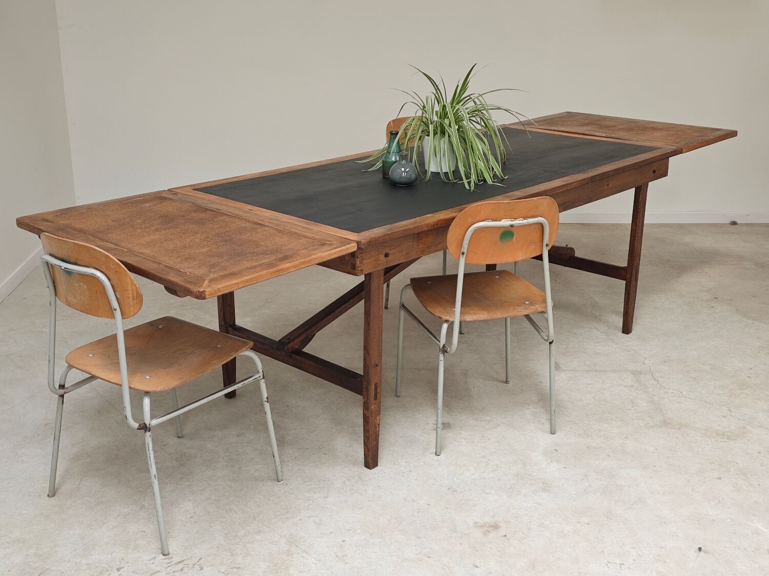 Vintage workshop folding table in oak with a hand-patinated black top.