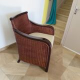 Vintage colonial-style armchair in woven rattan and exotic wood