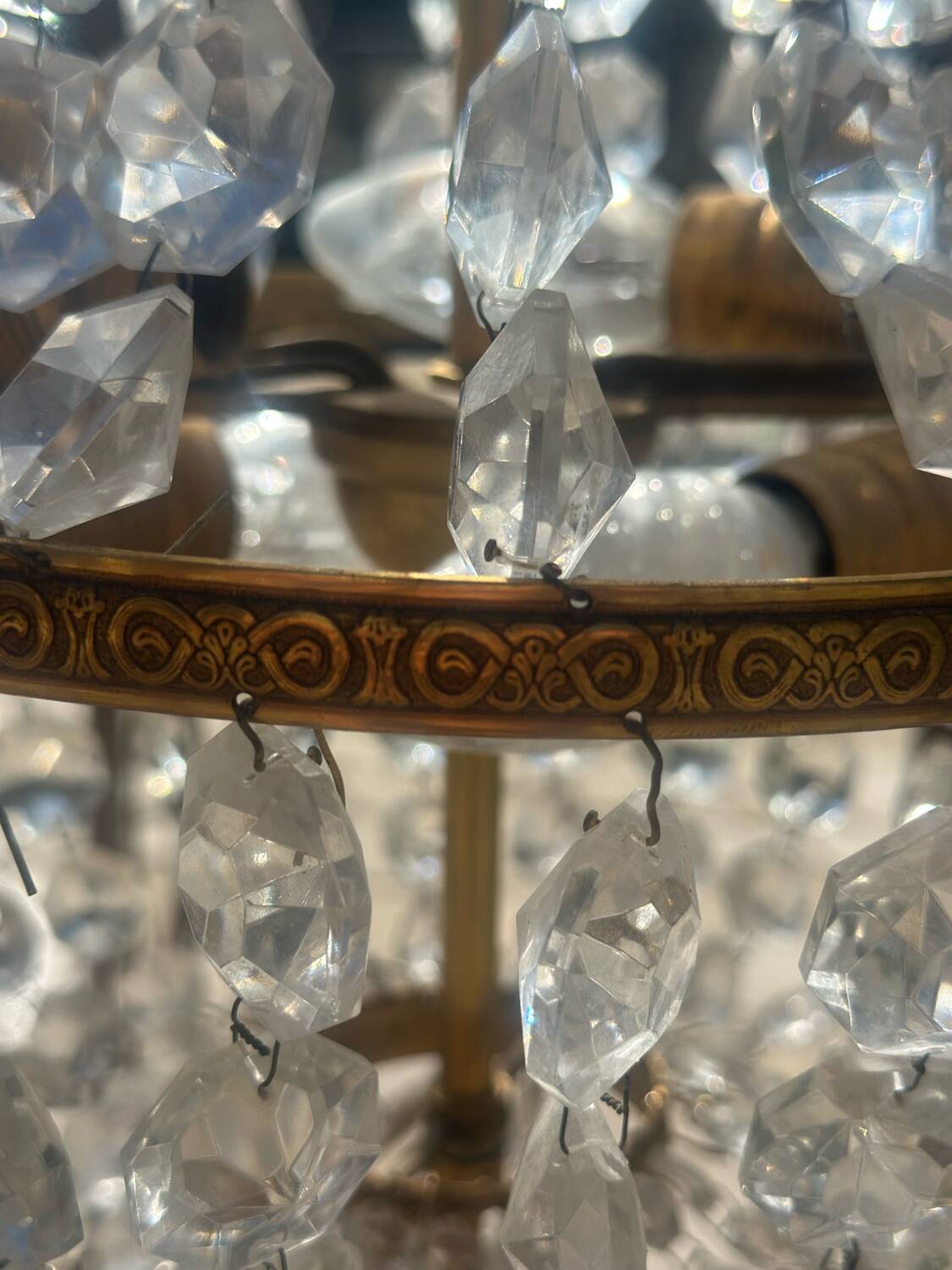 Basket chandelier with crystal and gilded brass pendants, circa 1930.