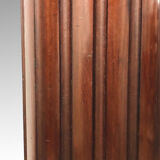 Fluted cylindrical column in mahogany and brass in the neoclassical style. 19th century.