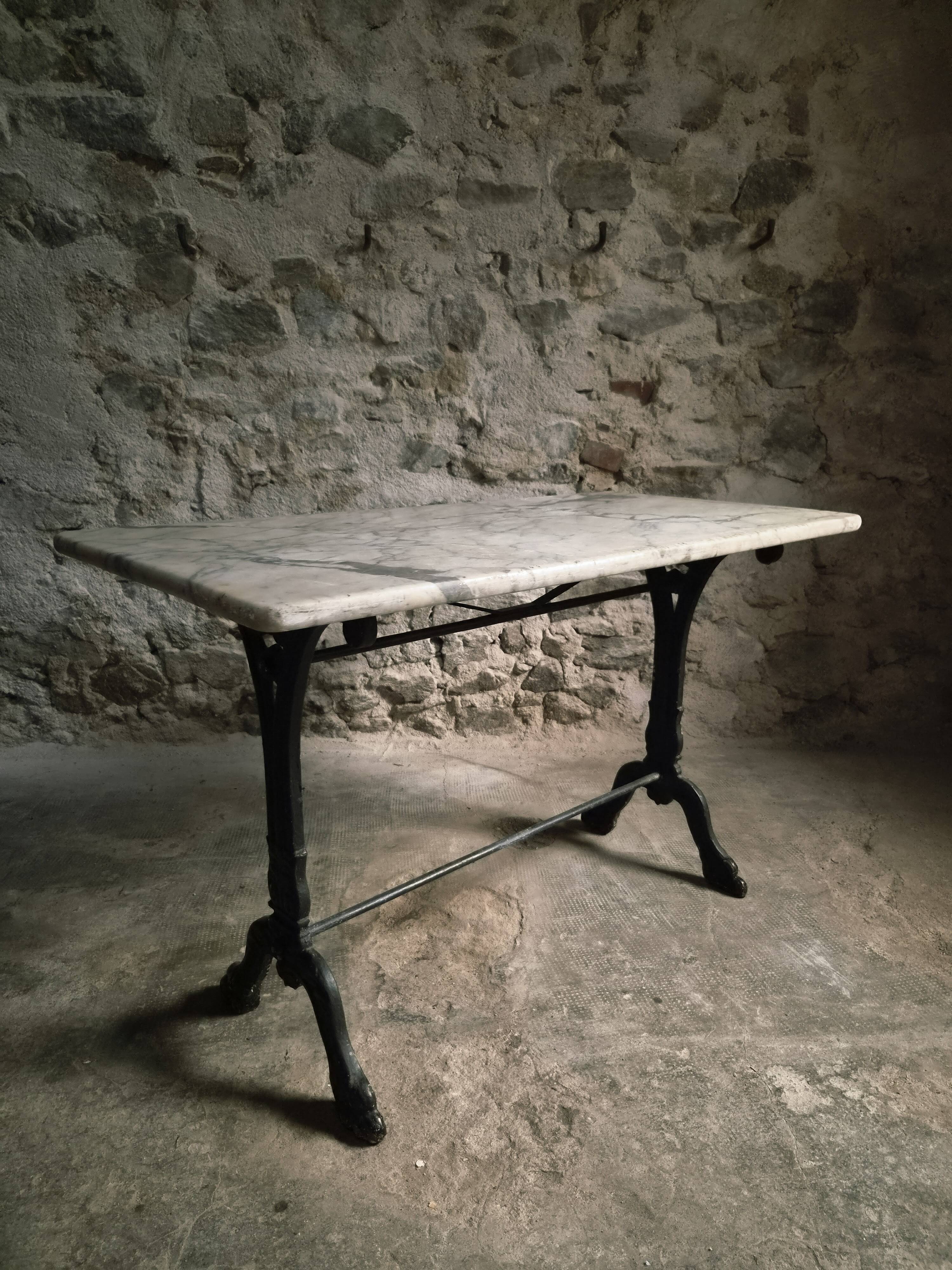 French bistro table made of marble with a cast iron base, 1920s–1930s.