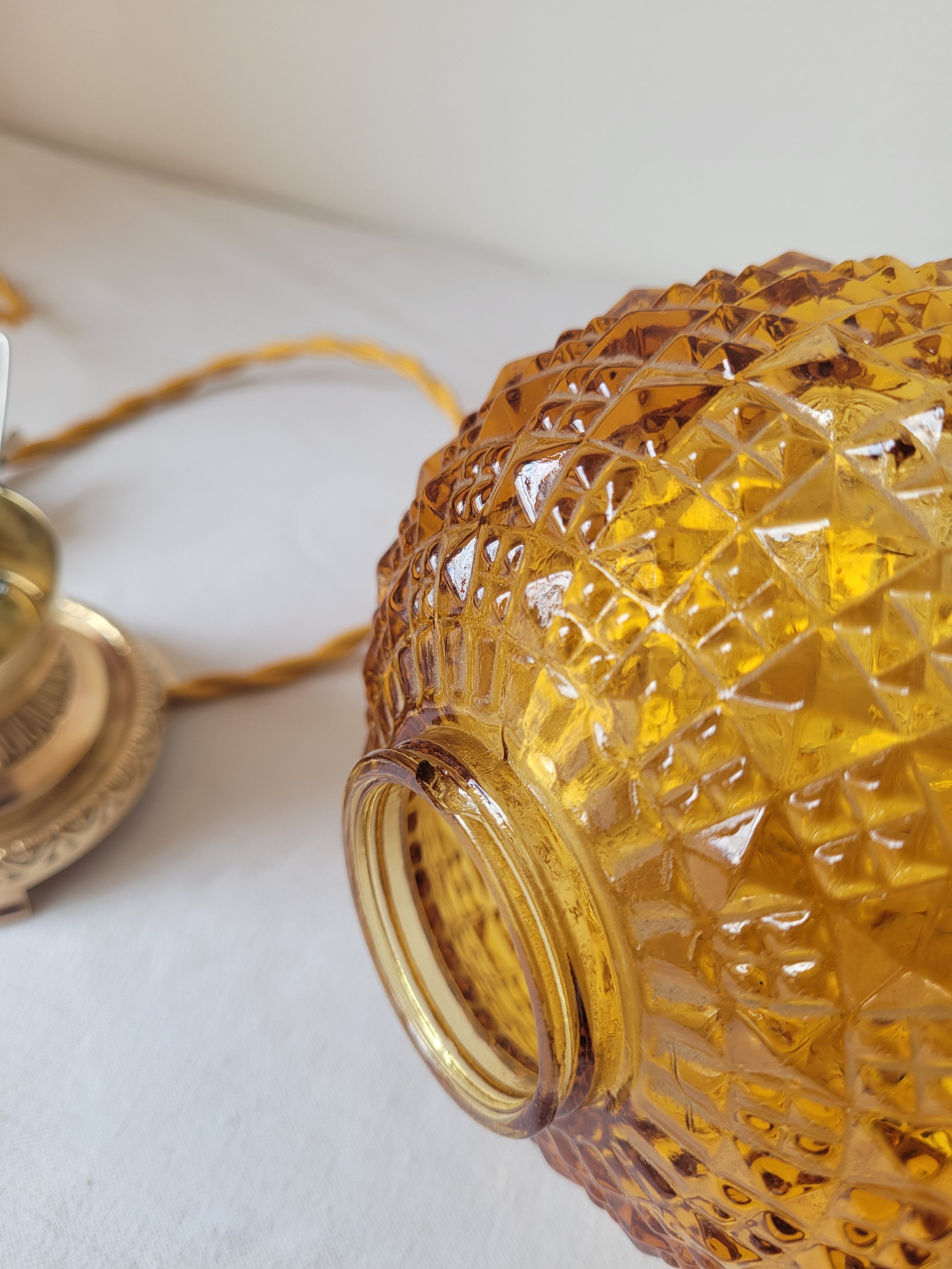 Bedside lamp in amber glass and brass