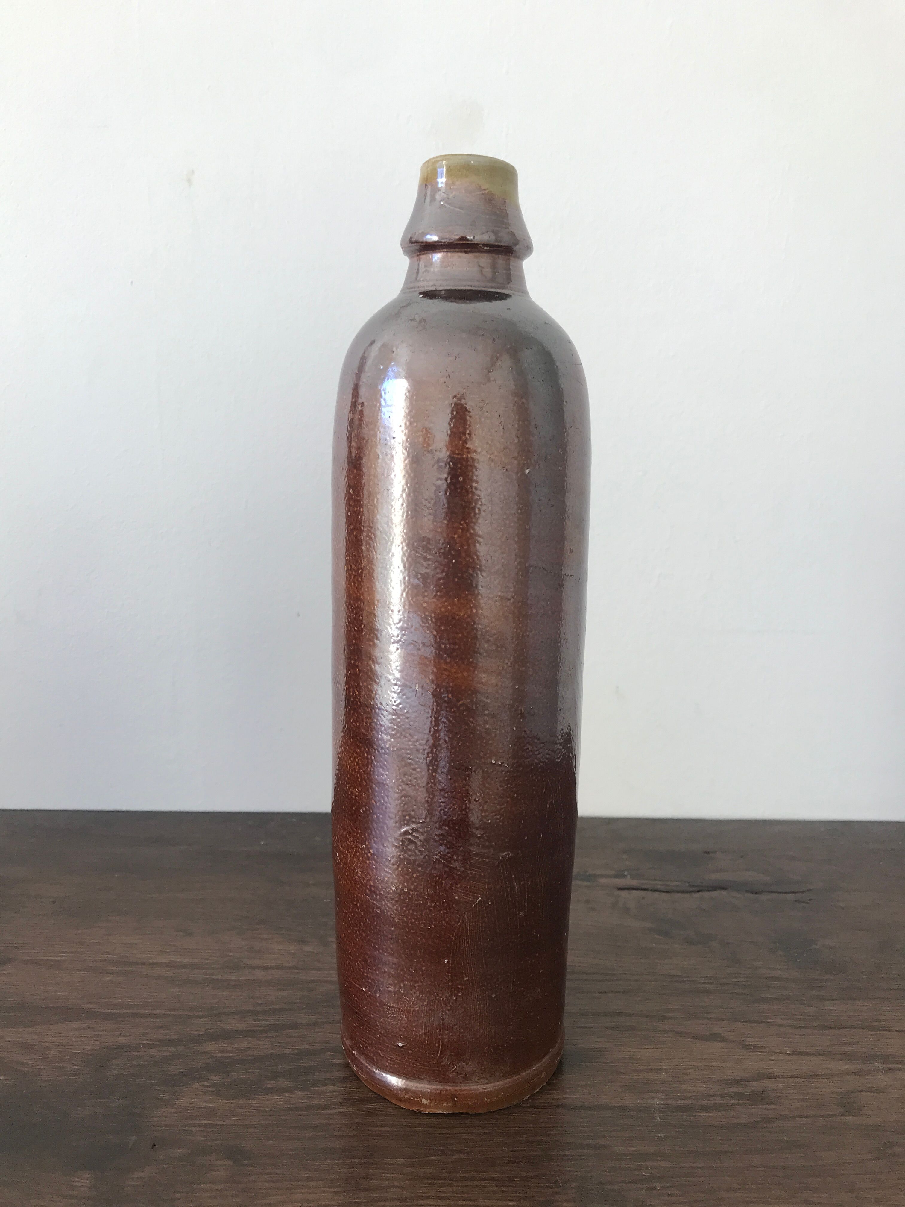 Pair of sandstone bottles