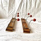 Pair of vintage wooden wall coat racks with three red ball hooks