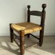 Chaise basse, de cheminée vintage style Charles Dudouyt en bois et paille