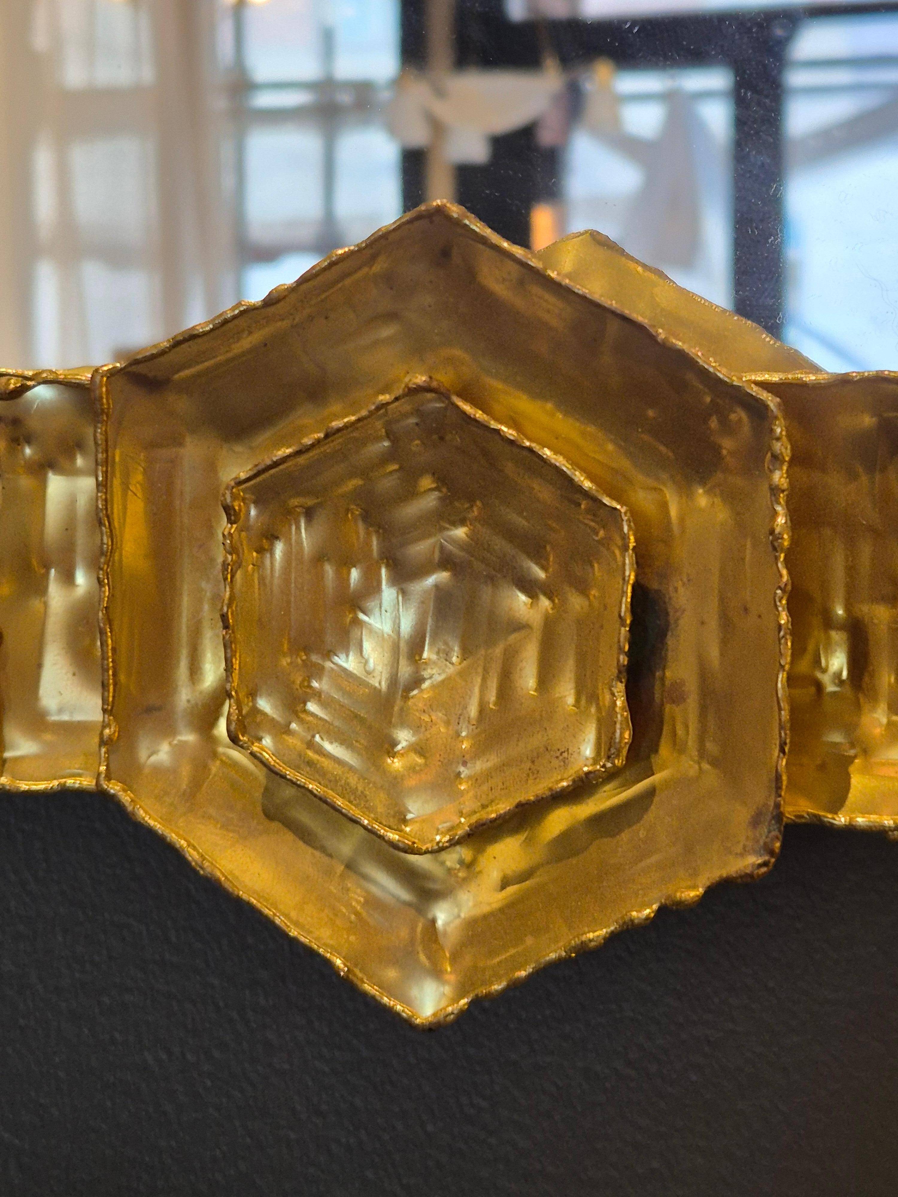 Brutalist brass mirrors by Claës E. Giertta