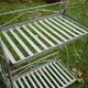 White wrought iron folding shelf