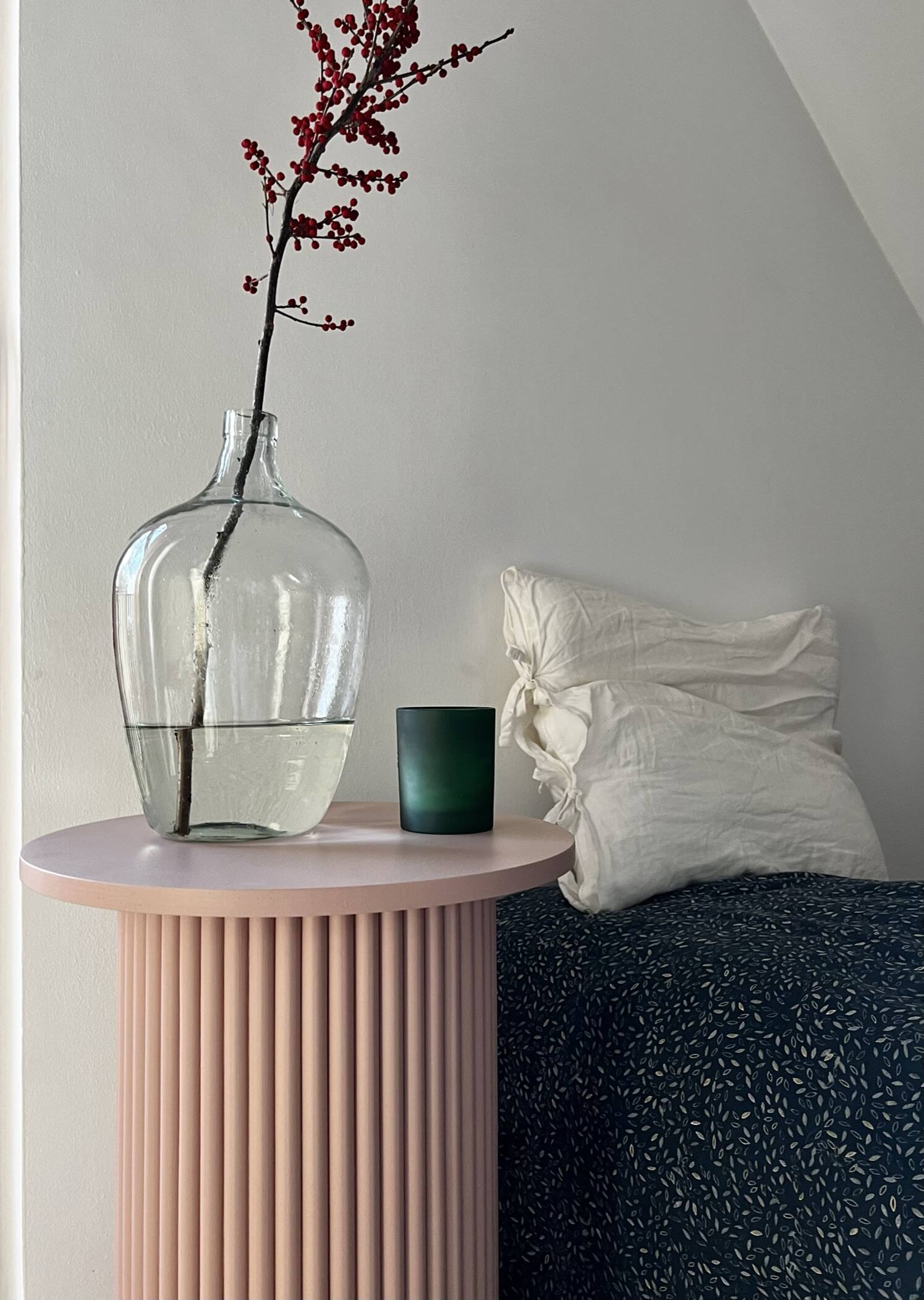 round and fluted bedside table in dusty pink