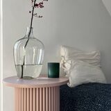 round and fluted bedside table in dusty pink