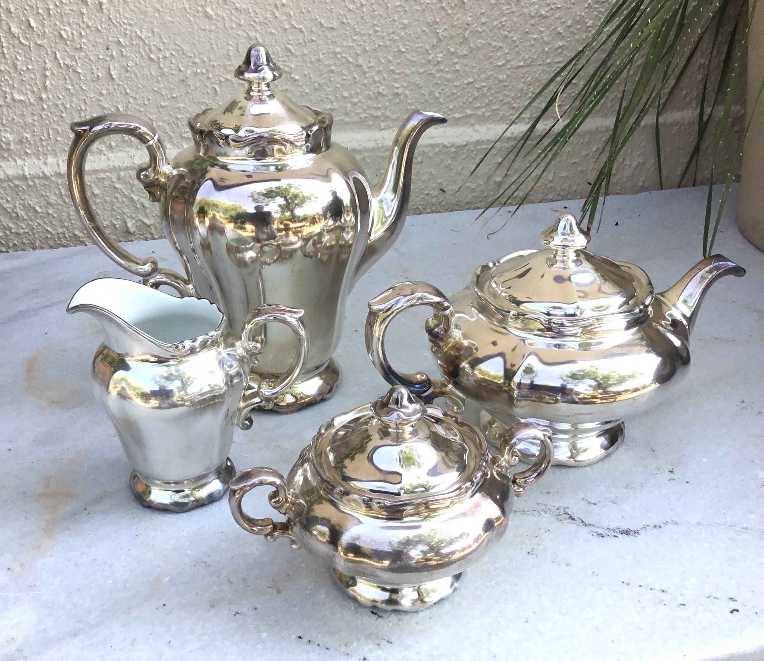 Tea and coffee service in porcelain and silvered enamel.