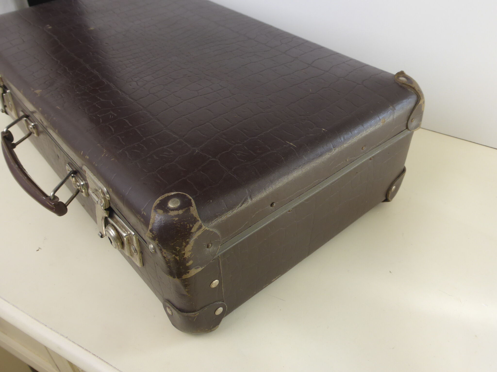 Old brown cardboard suitcase imitating the croco 50s/60s