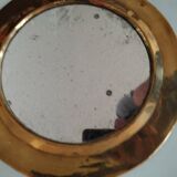 Pretty round mirror in brass and quilted glass