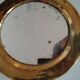 Pretty round mirror in brass and quilted glass