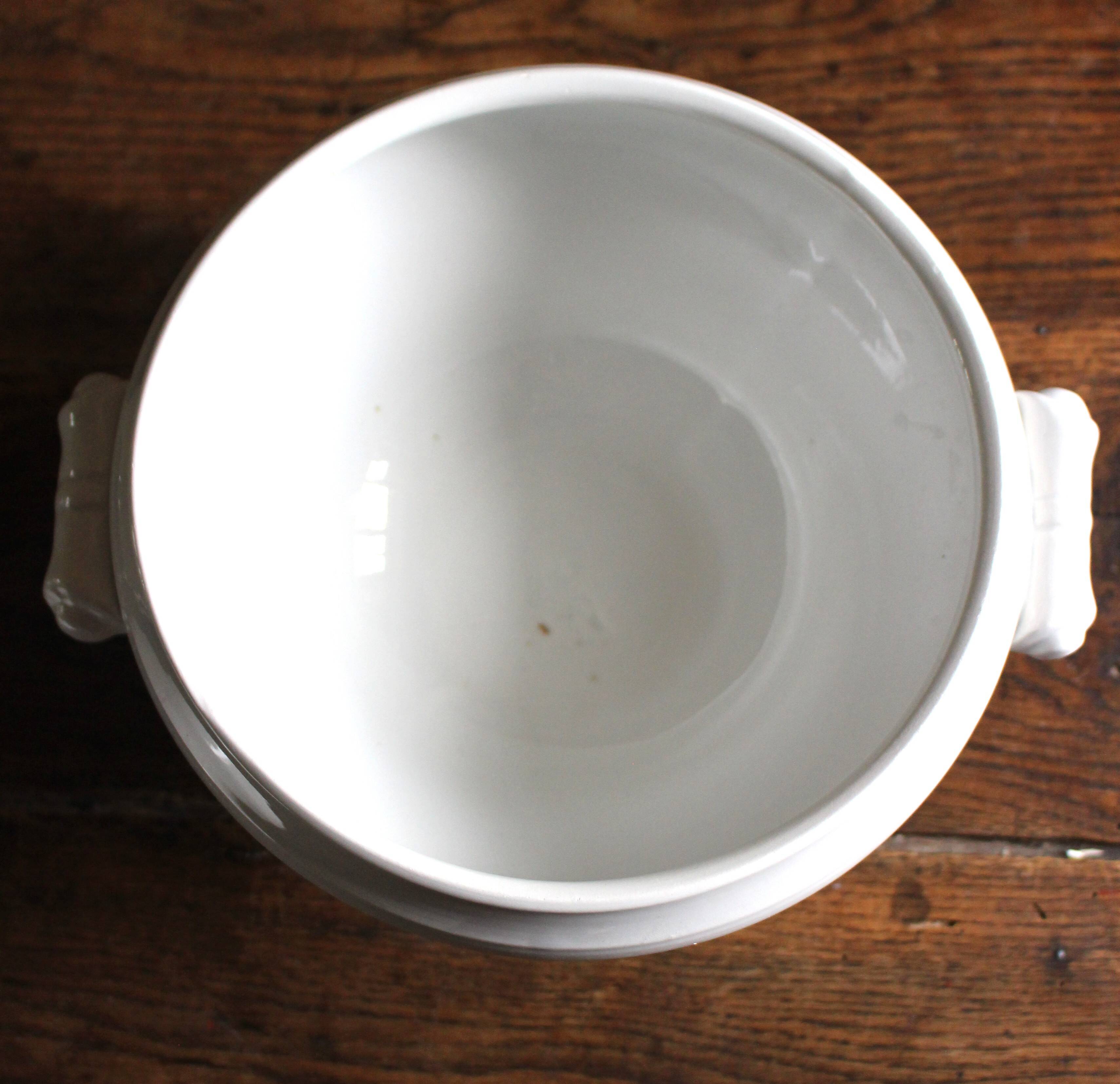 Antique soup tureen, white earthenware, with stopper decoration.