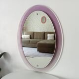 Vintage oval plexiglass mirror from the 70s by Harvey Guzzini