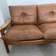 Scandinavian sofa in brown leather and solid wood