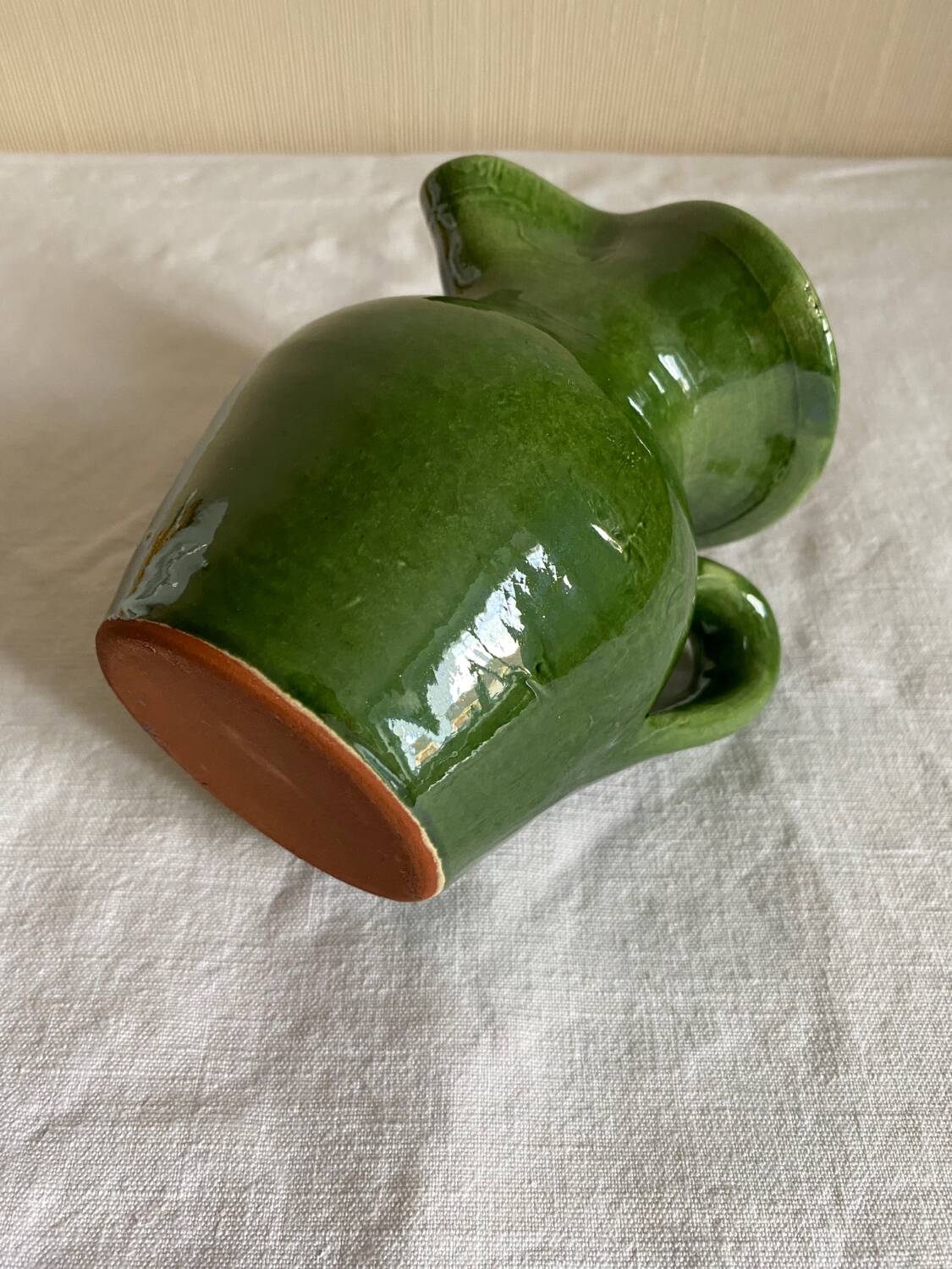 Provençal pitcher in green glazed earthenware
